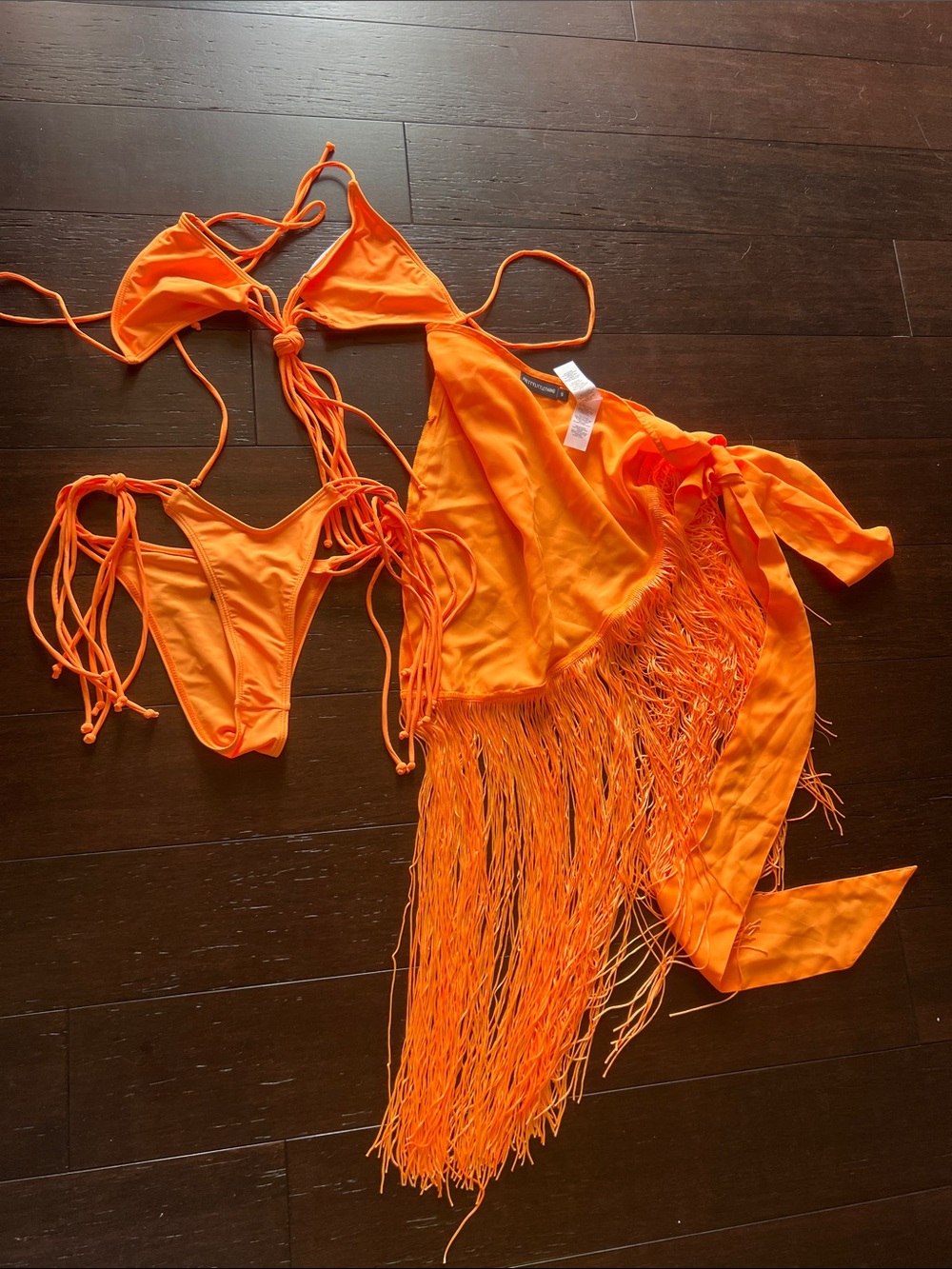 PrettyLittleThing Neon Orange String Bikini & coverup skirt.
